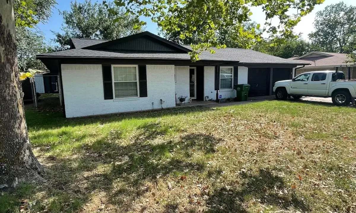 Professional roofing crew working on a residential roof in East Fishkill